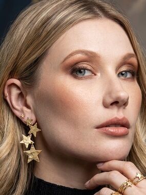 Bold Gold Tone Multi Layer Star Dangle Earrings